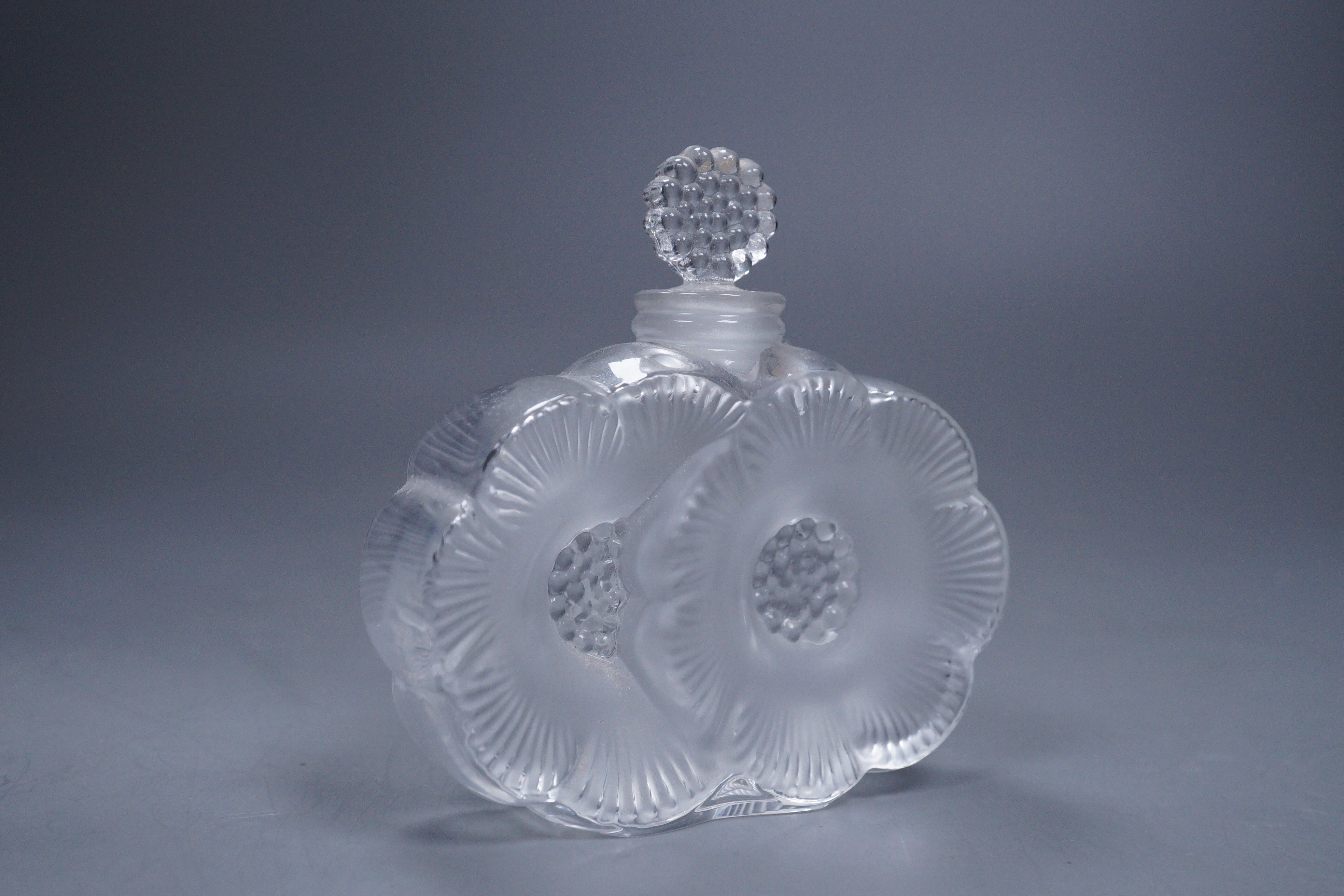 A Lalique Deux Fleurs scent bottle with stopper, 9cm tall